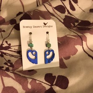 Blue rock climber cam earrings